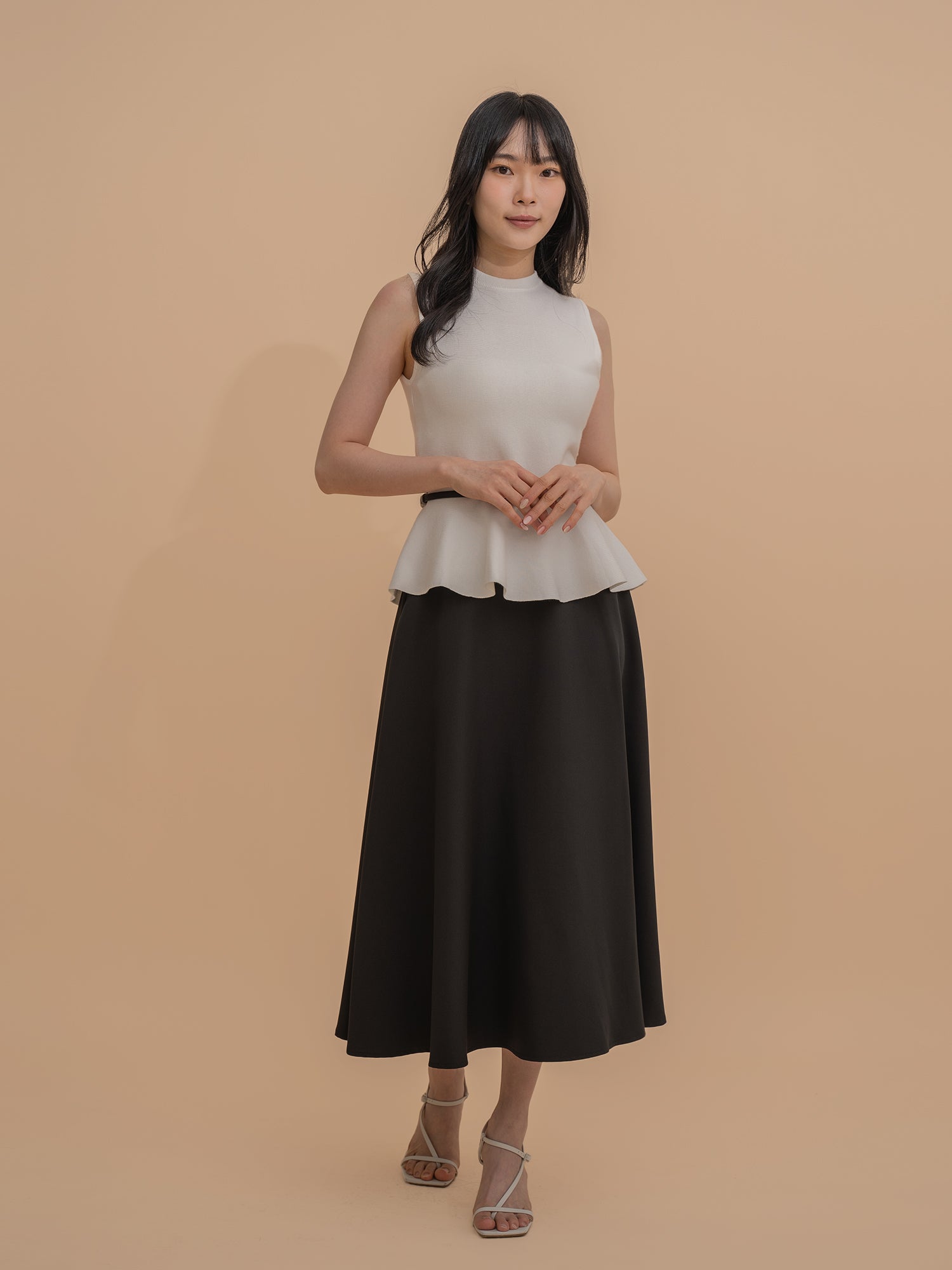 Sleeveless Peplum Knit Top